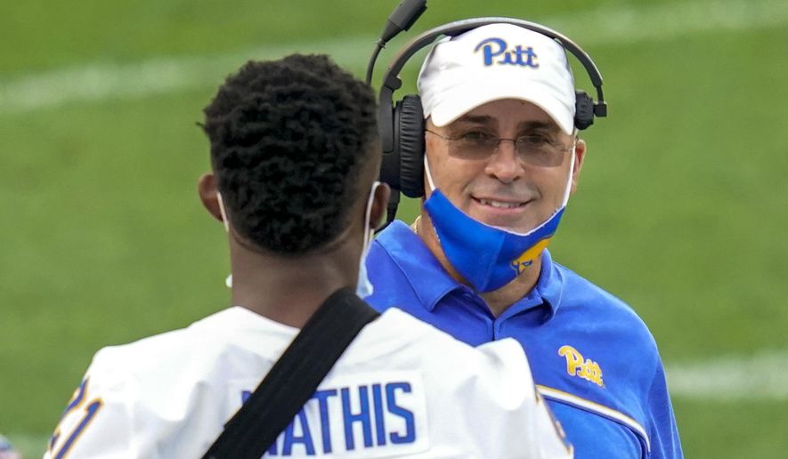 Pittsburgh coach Pat Narduzzi talks wit Damarri Mathis during the second half of the team&#39;s NCAA college football game against Austin Peay, Saturday, Sept. 12, 2020, in Pittsburgh. (AP Photo/Keith Srakocic)