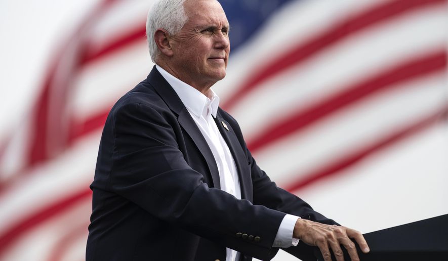Vice President Mike Pence looks on during a break in his speech at a Republican campaign rally in Belgrade, Mont., on Monday, Sept. 14, 2020. (AP Photo/Tommy Martino)