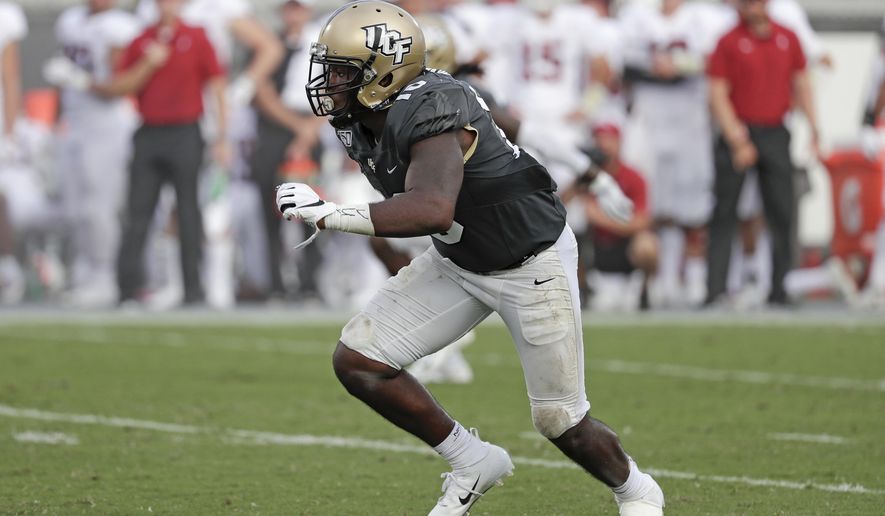 FILE - In this Sept. 14, 2019 file photo, Central Florida linebacker Eriq Gilyard rushes the Stanford line during the second half of an NCAA college football game in Orlando, Fla. Georgia Tech hosts Central Florida on Saturday, Sept. 19, 2020.(AP Photo/John Raoux, File)