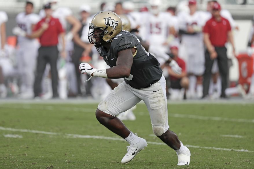 FILE - In this Sept. 14, 2019 file photo, Central Florida linebacker Eriq Gilyard rushes the Stanford line during the second half of an NCAA college football game in Orlando, Fla. Georgia Tech hosts Central Florida on Saturday, Sept. 19, 2020.(AP Photo/John Raoux, File)