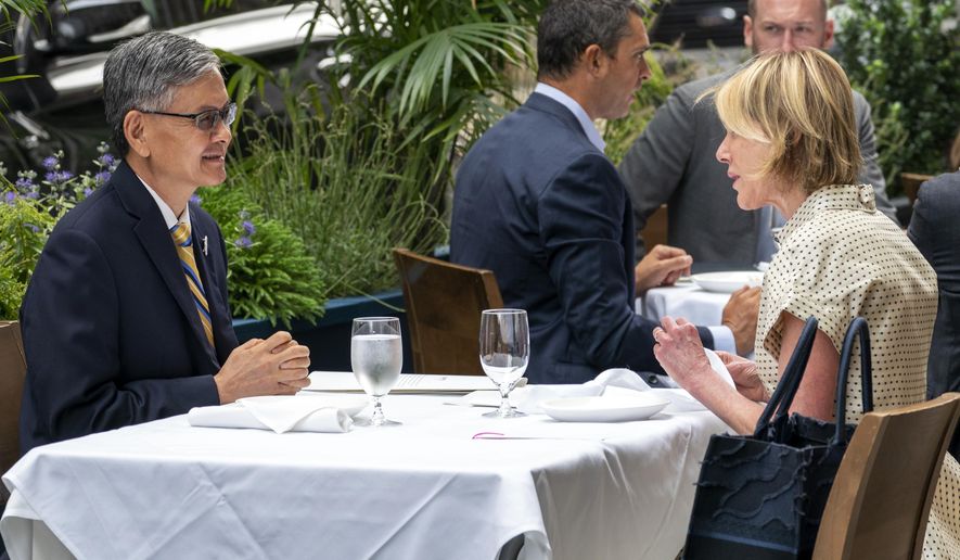 U.S. Ambassador to the United Nations Kelly Craft, right, meets James K.J. Lee, director-general of the Taipei Economic and Cultural Office in New York, for lunch at a restaurant in Midtown Manhattan, Wednesday, Sept. 16, 2020. (AP Photo/Mary Altaffer)