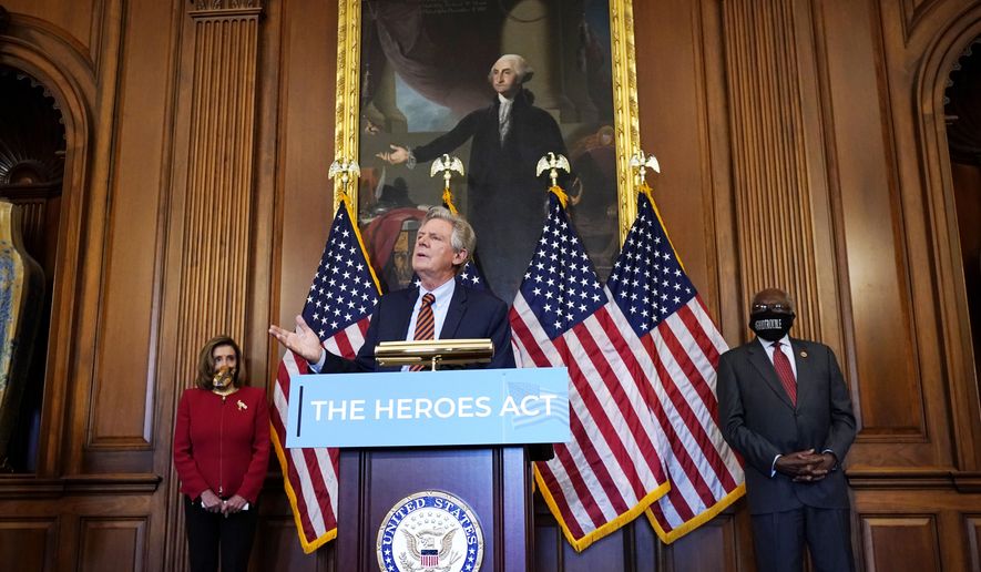Chairman of the House Energy and Commerce Committee Rep. Frank Pallone, D-N.J., center, speaks next to House Speaker Nancy Pelosi of Calif., left, and House Majority Whip James Clyburn, of S.C., during a news conference about COVID-19, Thursday, Sept. 17, 2020, on Capitol Hill in Washington. (AP Photo/Jacquelyn Martin)