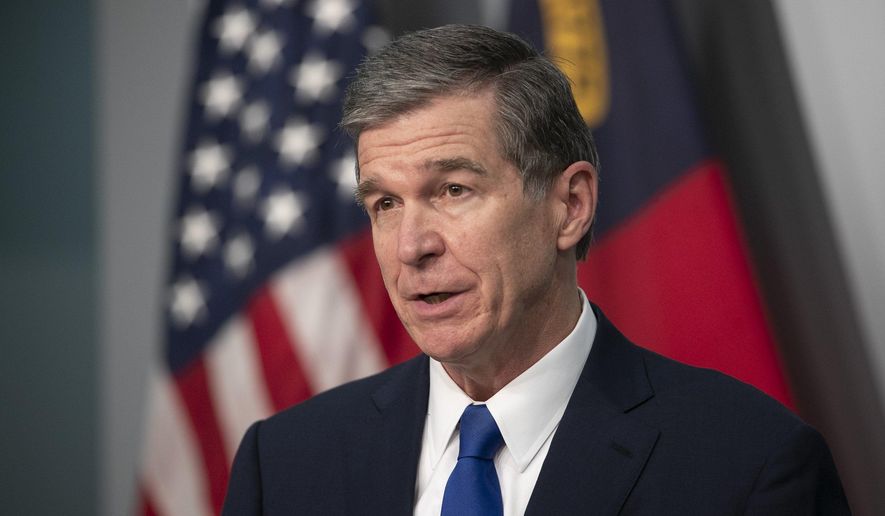 North Carolina Gov. Roy Cooper updates the public during a coronavirus press briefing on Thursday, Sept. 17, 2020, at the Emergency Operations Center in Raleigh, N.C. (Robert Willett/The News & Observer via AP)