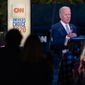 Audience members watch from their cars as Democratic presidential candidate Joe Biden, seen on a monitor, speaks during a CNN town hall in Moosic, Pa., Thursday, Sept. 17, 2020. (AP Photo/Carolyn Kaster)