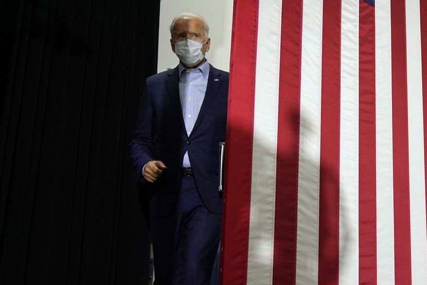 Democratic presidential candidate former Vice President Joe Biden walks in to speak at a union training center in Hermantown, Minn., Friday, Sept. 18, 2020. (AP Photo/Carolyn Kaster)