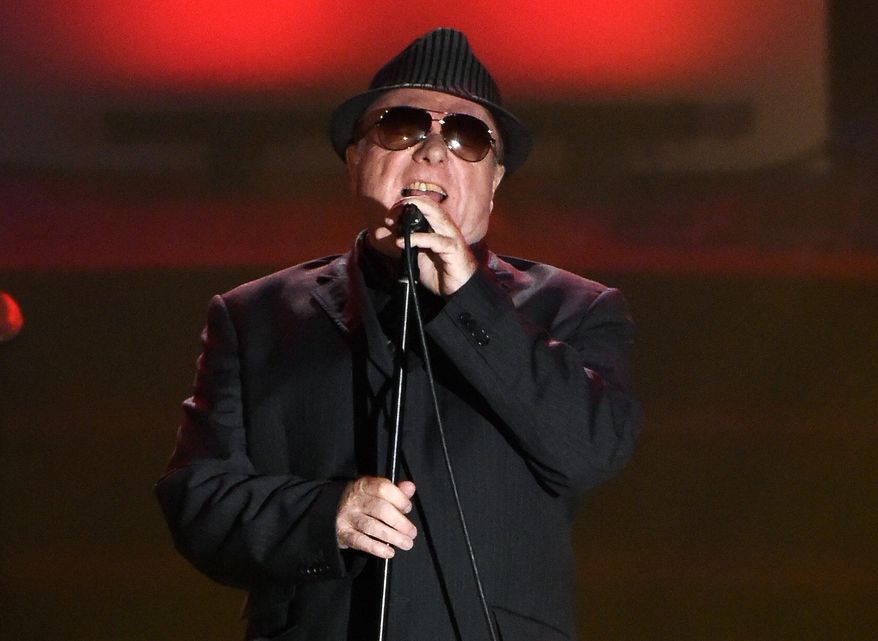 In this June 18, 2015, file photo, Van Morrison performs at the 46th annual Songwriters Hall of Fame Induction and Awards Gala in New York. Van Morrison is to release three new songs over the coming weeks that take a swipe at the lockdown restrictions imposed by the British government. (Photo by Evan Agostini/Invision/AP, File)