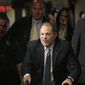 In this Monday, Feb. 24, 2020 file photo, Harvey Weinstein arrives at a Manhattan courthouse for jury deliberations in his rape trial, in New York. Britain has stripped disgraced movie mogul Harvey Weinstein of an honor recognizing his contribution to the UK film industry. The 68-year-old Weinstein was given the honor in 2004 and the decision to take it away was announced Friday Sept. 18, 2020. (AP Photo/Seth Wenig, File)  **FILE**