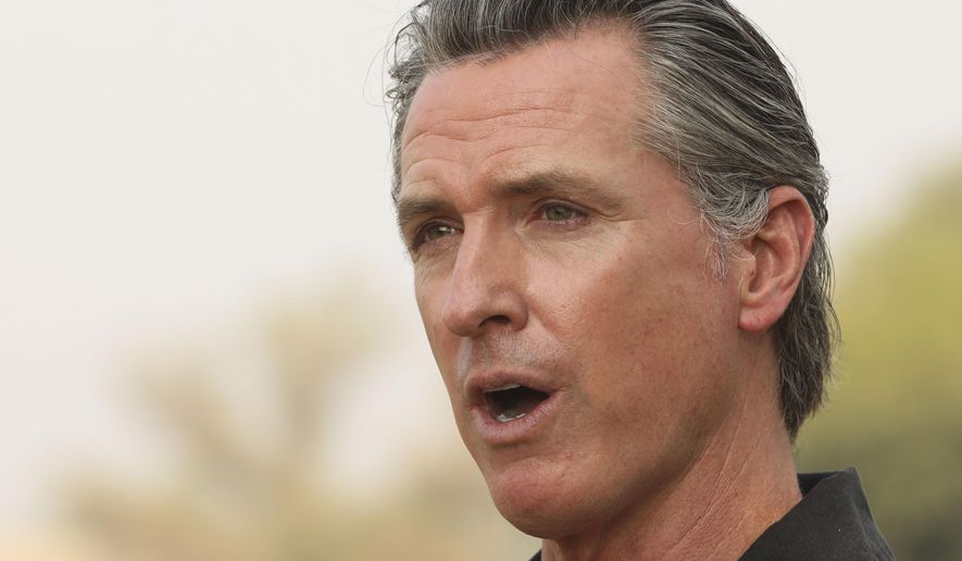 FILE - In this Sept. 14, 2020, file photo, California Gov. Gavin Newsom visits the Camelot Equestrian Park in Oroville, Calif. On Friday, Sept. 18, 2020, Gov. Newsom signed a law that makes more immigrants eligible for a tax credit. In June, California expanded the tax credit to immigrants who have jobs and pay taxes but don't have Social Security numbers. The law Newsom signed on Friday eliminates the requirement that immigrants must have children under the age of 6 to be eligible for the credit. (Carin Dorghalli/Bay Area News Group via AP, File)