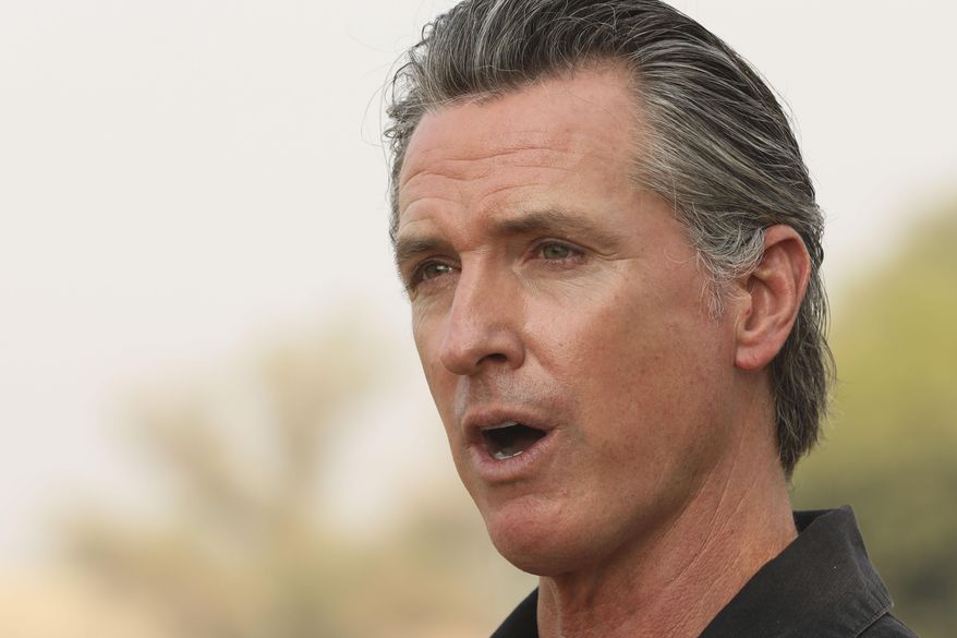 FILE - In this Sept. 14, 2020, file photo, California Gov. Gavin Newsom visits the Camelot Equestrian Park in Oroville, Calif. On Friday, Sept. 18, 2020, Gov. Newsom signed a law that makes more immigrants eligible for a tax credit. In June, California expanded the tax credit to immigrants who have jobs and pay taxes but don't have Social Security numbers. The law Newsom signed on Friday eliminates the requirement that immigrants must have children under the age of 6 to be eligible for the credit. (Carin Dorghalli/Bay Area News Group via AP, File)