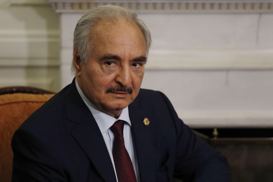 FILE - In this Jan. 17, 2020, file, photo shows Libyan Gen. Khalifa Hifter during a meeting in Athens.  Libya’s U.N.-supported government Friday, Aug. 21, 2020, announced a cease-fire across the oil-rich country and called for demilitarizing the strategic city of Sirte, which is controlled by rival forces.  Fayez Sarraj, head of the Government of National Accord in the capital Tripoli, also announced parliamentary and presidential elections would be held in March. Both administrations said they want an end to an oil blockade imposed by the camp of military commander Khalifa Hifter since earlier this year.  (AP Photo/Thanassis Stavrakis, File)