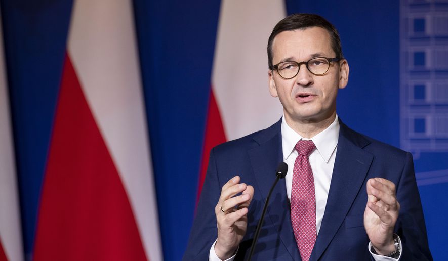 Poland&#39;s Prime Minister Mateusz Morawiecki speaks during a news conference following joint meetings of the government of the Lithuania and the government of the Poland at the Palace of the Grand Dukes of Lithuania in Vilnius, Lithuania, Thursday, Sept. 17, 2020. (AP Photo/Mindaugas Kulbis)