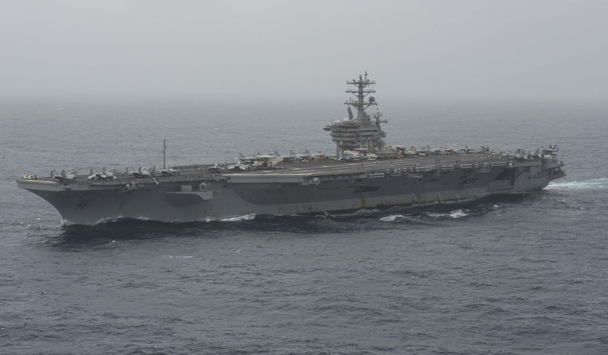 In this photo released by the U.S. Navy, the aircraft carrier USS Nimitz transits the Arabian Sea on Aug. 17, 2020. The U.S. Navy searched through the night into the morning of Monday, Sept. 7, 2020, for a sailor who went missing from the aircraft carrier USS Nimitz during its patrol of the northern Arabian Sea amid tensions with Iran. (Mass Communication Specialist 3rd Class Elliot Schaudt/U.S. Navy via AP)