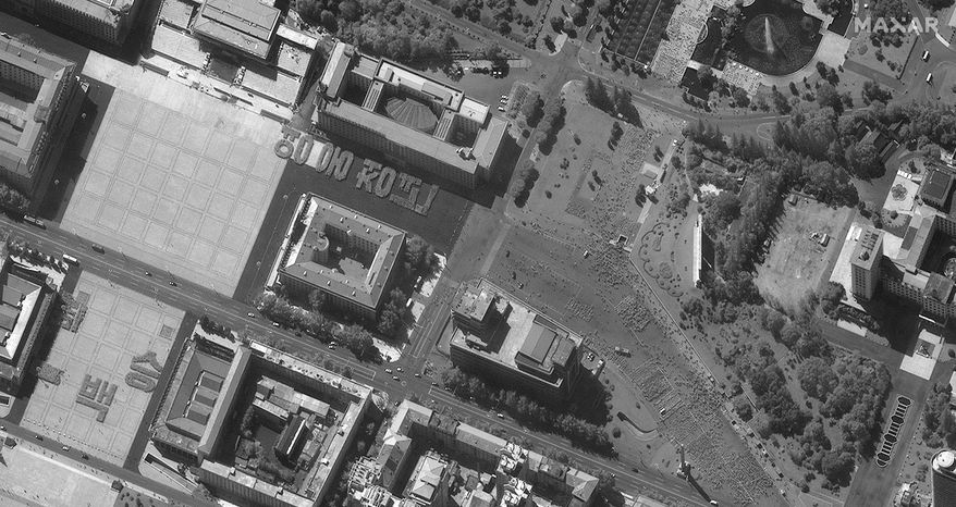 This Sept. 17, 2020, photo,  provided by Maxar Technologies shows a parade rehearsal Kim Il Sung Square in Pyongyang, North Korea.(Satellite image ©2020 Maxar Technologies via AP)
