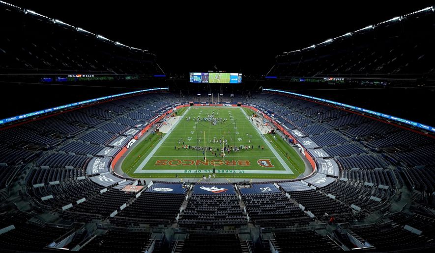 The Denver Broncos and the Tennessee Titans take the field in an empty stadium prior to an NFL football game, Monday, Sept. 14, 2020, in Denver. (AP Photo/Jack Dempsey)