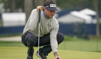 Bubba Watson, of the United States, lines up his putt on the fifth green during the second round of the US Open Golf Championship, Friday, Sept. 18, 2020, in Mamaroneck, N.Y. (AP Photo/John Minchillo)