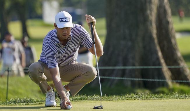 Harris English, of the United States, lines up a shot on on the fifth green during the second round of the US Open Golf Championship, Friday, Sept. 18, 2020, in Mamaroneck, N.Y. (AP Photo/John Minchillo)