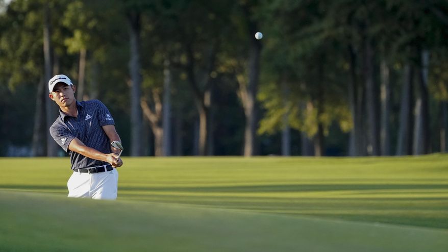 Collin Morikawa, of the United States, chips onto the eighth green during the second round of the US Open Golf Championship, Friday, Sept. 18, 2020, in Mamaroneck, N.Y. (AP Photo/John Minchillo)