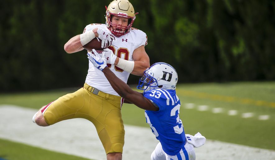 Boston College tight end Hunter Long (80) catches a touchdown pass against Duke Blue cornerback Leonard Johnson (33) during the second half of an NCAA college football game, Saturday, Sept. 19, 2020, in Durham, N.C. (Nell Redmond/Pool Photo via AP)