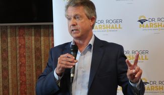FILE - U.S. Rep. Roger Marshall, R-Kan., speaks to a local Elephant Club meeting in the banquet room of a restaurant in Overland Park, Kan. on Aug. 18, 2020.  Marshall and Democrat state Sen. Barbara Bollier will meet in their first debate of their race to replace retiring Sen. Pat Roberts. (AP Photo/John Hanna, File)
