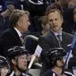 FILE - In this Nov. 21, 2015, file photo, Tampa Bay Lightning head coach Jon Cooper, right, talks to assistant coach Rick Bowness during the first period of an NHL hockey game against the Anaheim Ducks in Tampa, Fla. For the first time in NHL history, a coach is facing a former assistant in the Stanley Cup Final. Dallas Stars interim coach Bowness worked five years as an assistant under Cooper with the Lightning. They parted ways in 2008 and are now facing off in a series of old school vs. new school coaches. (AP Photo/Chris O&#39;Meara, File)