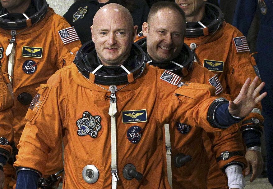 FILE - In this May 16, 2011, file photo, former NASA astronaut STS-134 commander Mark Kelly, front, waves a he leaves the Operations and Checkout Building with fellow crew members, including Mike Fincke, for a trip to Launch Pad 39-A, and a planned liftoff on the space shuttle Endeavour at Kennedy Space Center in Cape Canaveral, Fla. A Kelly victory would shrink the GOP&#39;s Senate majority at a crucial moment and complicate the path to confirmation for President Donald Trump&#39;s Supreme Court nominee. (AP Photo/Chris O&#39;Meara, File)