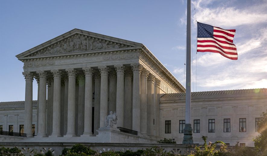 The flag flies at half-staff at the Supreme Court on the morning after the death of Justice Ruth Bader Ginsburg, 87, Saturday, Sept. 19, 2020 in Washington. (AP Photo/J. Scott Applewhite)