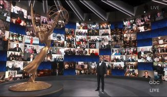 In this video grab captured on Sept. 20, 2020, courtesy of the Academy of Television Arts &amp;amp; Sciences and ABC Entertainment, host Jimmy Kimmel appears with a screen filled with nominees during the 72nd Emmy Awards broadcast. (The Television Academy and ABC Entertainment via AP)