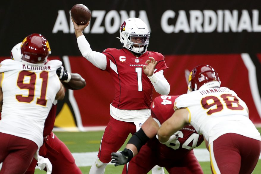 Arizona Cardinals quarterback Kyler Murray (1) throws as Washington Football Team defensive end Ryan Kerrigan (91) and defensive tackle Matthew Ioannidis (98) pursue during the first half of an NFL football game, Sunday, Sept. 20, 2020, in Glendale, Ariz. (AP Photo/Darryl Webb)