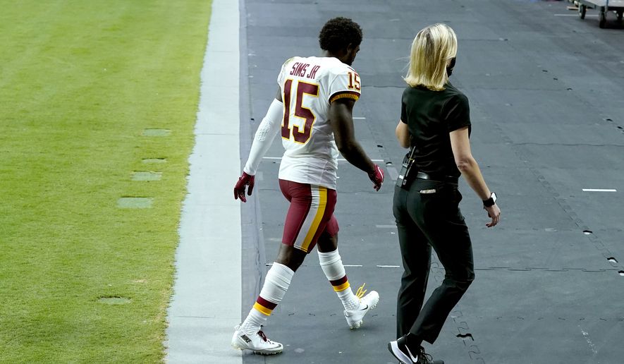 Washington Football Team wide receiver Steven Sims (15) leaves the field during the second half of an NFL football game against the Arizona Cardinals, Sunday, Sept. 20, 2020, in Glendale, Ariz. (AP Photo/Ross D. Franklin) **FILE**