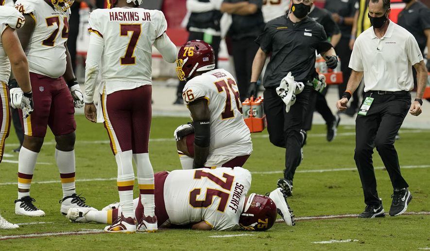 Washington Football Team offensive guard Brandon Scherff (75) lies on the turf after an injury against the Arizona Cardinals during the first half of an NFL football game, Sunday, Sept. 20, 2020, in Glendale, Ariz.(AP Photo/Ross D. Franklin)  **FILE**