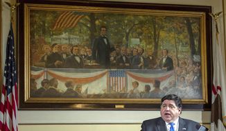 FILE - In this May 22, 2020 file photo, Illinois Gov. JB Pritzker answers questions from the media, from his office at the Illinois State Capitol, in Springfield, Ill., in front of a painting painting depicting a political debate in Charleston, Ill., on Sept. 18, 1858 between Stephen A. Douglas and Abraham Lincoln. (Justin L. Fowler/The State Journal-Register via AP, Pool File)/The State Journal-Register via AP)