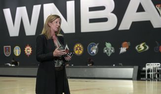 WNBA Commissioner Cathy Engelbert answers questions about a postponed game between the Seattle Storm and the Minnesota Lynx after Game 1 of a WNBA basketball semifinal round playoff game between the Connecticut Sun and the Las Vegas Aces, Sunday, Sept. 20, 2020, in Bradenton, Fla. (AP Photo/Phelan M. Ebenhack)