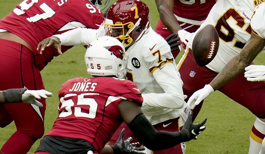 Arizona Cardinals linebacker Chandler Jones (55) recovers a fumble by Washington Football Team quarterback Dwayne Haskins (7) during the first half of an NFL football game, Sunday, Sept. 20, 2020, in Glendale, Ariz. (AP Photo/Ross D. Franklin)