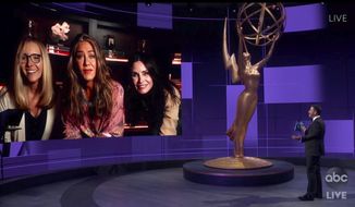 In this video grab captured on Sept. 20, 2020, courtesy of the Academy of Television Arts &amp;amp; Sciences and ABC Entertainment, Jimmy Kimmel, right, speaks with actors, from left, Lisa Kudrow, Jennifer Aniston and Courteney Cox during the 72nd Emmy Awards broadcast. (The Television Academy and ABC Entertainment via AP)