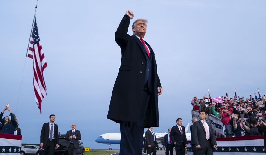President Donald Trump arrives for a campaign rally at Fayetteville Regional Airport, Saturday, Sept. 19, 2020, in Fayetteville, N.C. (AP Photo/Evan Vucci)