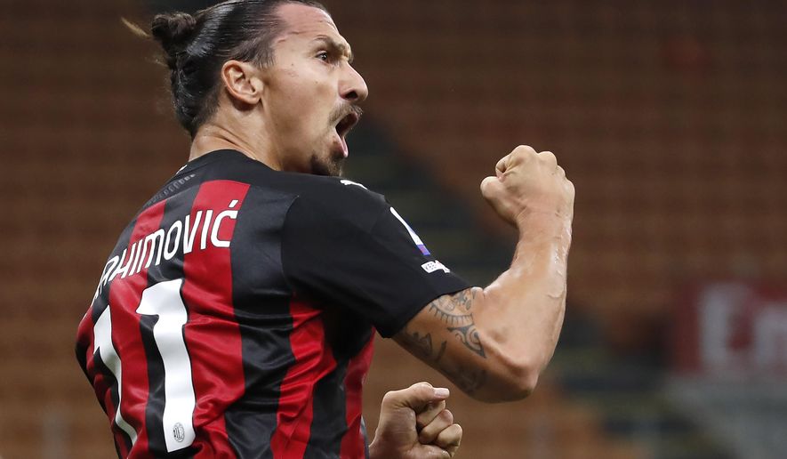 AC Milan's Zlatan Ibrahimovic celebrates his goal against Bologna during the Serie A soccer match between AC Milan and Bologna at the San Siro stadium, in Milan, Italy, Monday, Sept. 21, 2020. (AP Photo/Antonio Calanni)