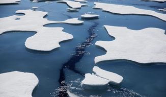 Sea ice breaks apart as the Finnish icebreaker MSV Nordica traverses the Northwest Passage through the Victoria Strait in the Canadian Arctic Archipelago in a Friday, July 21, 2017, file photo.  The National Snow and Ice Data Center&#39;s figures Monday, Sept. 21, 2020, show that sea ice last week was only 1.4 million square miles when it reached its annual low mark for the summer. In the 1980s it was always at least 1 million square miles more. (AP Photo/David Goldman, File)