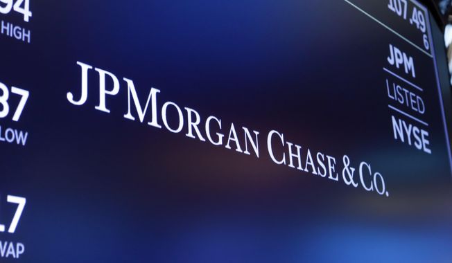 FILE - In this Aug. 16, 2019, file photo, the logo for JPMorgan Chase &amp;amp; Co. appears above a trading post on the floor of the New York Stock Exchange in New York.  Shares of some major banks are tumbling before the market open Monday, Sept . 21, 2020, following a report alleging those including JPMorgan, HSBC, Standard Chartered Bank, Deutsche Bank and Bank of New York Mellon continued to profit from illicit dealings with disreputable people and criminal networks despite being previously fined for similar actions.   (AP Photo/Richard Drew, File)