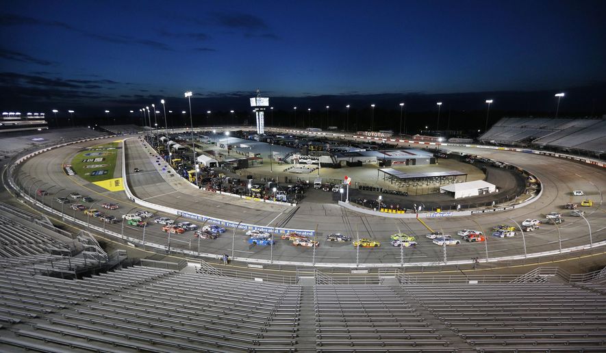 NASCAR Cup Series 63rd Annual Federated Auto Parts 400 at Richmond Raceway, Saturday 9/12/2020. Cars take the first turn amidst empty seats to begin a NASCAR Cup Series auto race Saturday, Sept. 12, 2020, in Richmond, Va. (James Wallace/Richmond Times-Dispatch via AP)  **FILE**