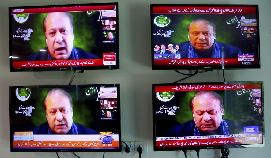 Pakistani news channels telecast live of Pakistan&#39;s ailing former Prime Minister Nawaz Sharif addressing to an opposition parties meeting in Islamabad, Pakistan on Sunday, Sept. 21, 2020. Sharif broke a yearlong silence from exile in London to vow to oust Imran Khan from office, accusing him of only reaching power through a vote rigged by the country&#39;s powerful military. (AP Photo/Anjum Naveed)