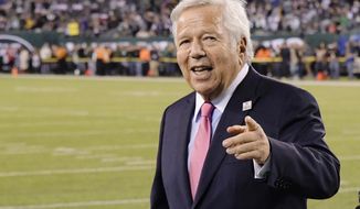 FILE - In this Oct. 21, 2019, file photo, New England Patriots owner Robert Kraft points to fans as his team warms up before an NFL football game against the New York Jets in East Rutherford, N.J.  Florida prosecutors said Monday, Sept. 21, 2020, that they will not appeal a court&#39;s decision to block video allegedly showing Kraft paying for massage parlor sex, making it likely the charges against him will be dropped. (AP Photo/Bill Kostroun, File)