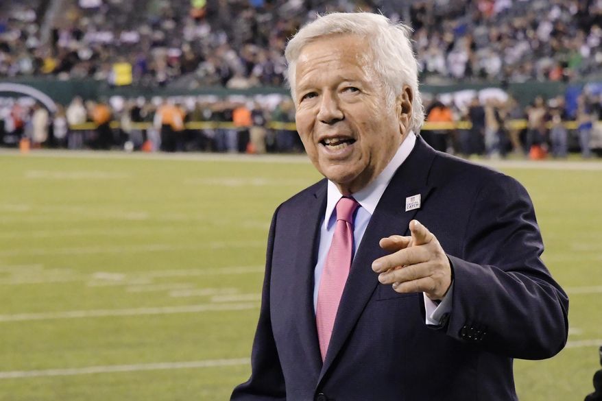 FILE - In this Oct. 21, 2019, file photo, New England Patriots owner Robert Kraft points to fans as his team warms up before an NFL football game against the New York Jets in East Rutherford, N.J.  Florida prosecutors said Monday, Sept. 21, 2020, that they will not appeal a court&#39;s decision to block video allegedly showing Kraft paying for massage parlor sex, making it likely the charges against him will be dropped. (AP Photo/Bill Kostroun, File)