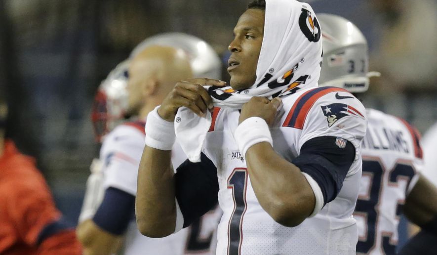 New England Patriots quarterback Cam Newton (1) reacts on the sideline during the fourth quarter of an NFL football game against the Seattle Seahawks, Sunday, Sept. 20, 2020, in Seattle. The Seahawks won 35-30. (AP Photo/John Froschauer)