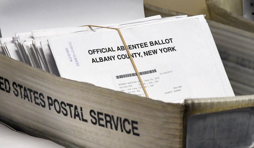 In this June 30, 2020, photo, a box of absentee ballots wait to be counted at the Albany County Board of Elections in Albany, N.Y. A New York federal judge ordered the U.S. Postal Service to live up to its responsibilities to timely process election mail. The Monday, Sept. 21 written decision by Judge Victor Marrero came after several individuals including candidates for public office sued. (AP Photo/Hans Pennink) **FILE**