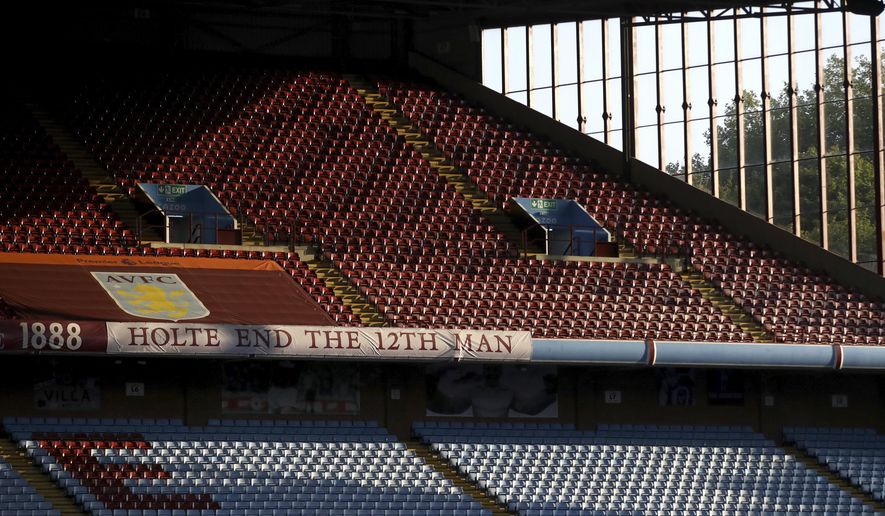 The sun illuminates the empty stands before the English Premier League soccer match between Aston Villa and Sheffield United at the Villa Park stadium in Birmingham, Monday, Sept. 21, 2020. (Tim Goode/Pool via AP)