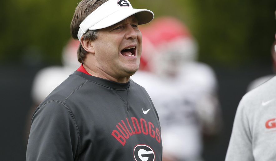 FILE - In this Tuesday, March 26, 2019, file photo, Georgia coach Kirby Smart is shown during an NCAA college football spring practice in Athens, Ga. Kirby Smart gives much credit to first-year Arkansas coach Sam Pittman for helping to make No. 4 Georgia an annual contender for the Southeastern Conference championship. Georgia opens its season at Arkansas on Saturday, Sept. 26, 2020, in Pittman’s debut as the Razorbacks coach. Pittman was one of Smart’s top assistants as the Bulldogs’ offensive line coach for four seasons. (Joshua L. Jones/Athens Banner-Herald via AP, File)
