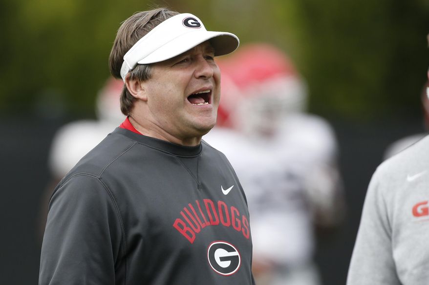 FILE - In this Tuesday, March 26, 2019, file photo, Georgia coach Kirby Smart is shown during an NCAA college football spring practice in Athens, Ga. Kirby Smart gives much credit to first-year Arkansas coach Sam Pittman for helping to make No. 4 Georgia an annual contender for the Southeastern Conference championship. Georgia opens its season at Arkansas on Saturday, Sept. 26, 2020, in Pittman’s debut as the Razorbacks coach. Pittman was one of Smart’s top assistants as the Bulldogs’ offensive line coach for four seasons. (Joshua L. Jones/Athens Banner-Herald via AP, File)