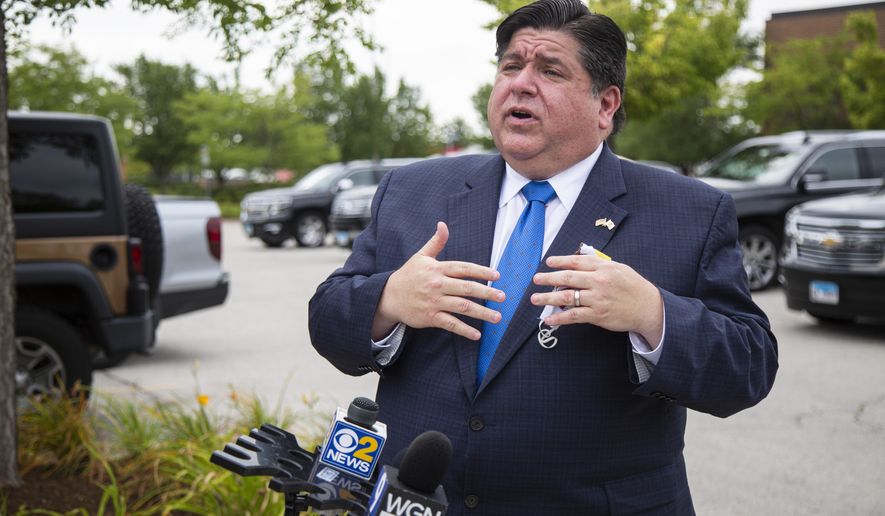 FILE - In this Aug. 10, 2020 file photo, Gov. J.B. Pritzker responds to questions during news conference in Chicago. Illinois tweaked how business owners seeking recreational marijuana licenses can apply following complaints that the process favored politically connected and rich applicants over minorities and veterans who were supposed to benefit. Pritzker, a first-term Democrat, was expected to discuss the changes at a Tuesday, Sept. 22, 2020, news conference. (Anthony Vazquez/Chicago Sun-Times via AP File)