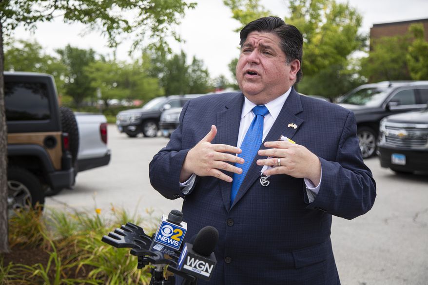 FILE - In this Aug. 10, 2020 file photo, Gov. J.B. Pritzker responds to questions during news conference in Chicago. Illinois tweaked how business owners seeking recreational marijuana licenses can apply following complaints that the process favored politically connected and rich applicants over minorities and veterans who were supposed to benefit. Pritzker, a first-term Democrat, was expected to discuss the changes at a Tuesday, Sept. 22, 2020, news conference. (Anthony Vazquez/Chicago Sun-Times via AP File)