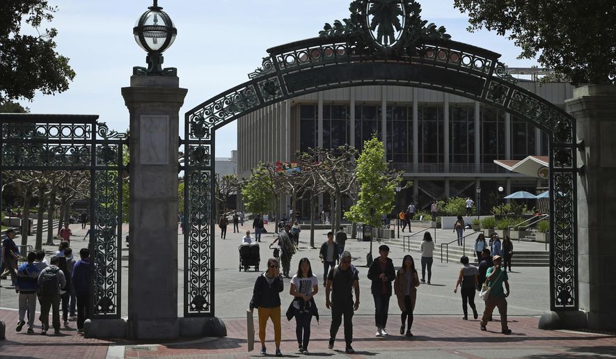  In this May 10, 2018, file photo, students walk past Sather Gate on the University of California at Berkeley campus in Berkeley, Calif.  (AP Photo/Ben Margot, File)  **FILE**